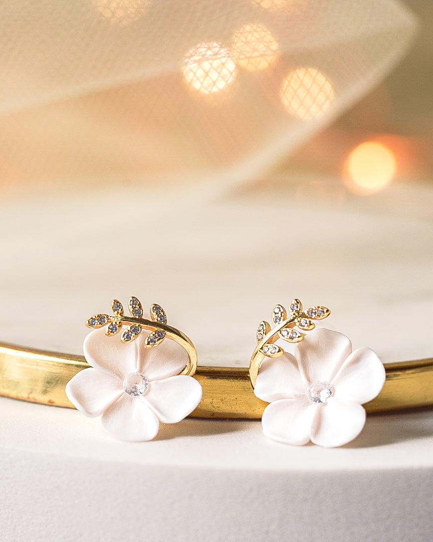 small white flowers with gold branches on the top stud earring